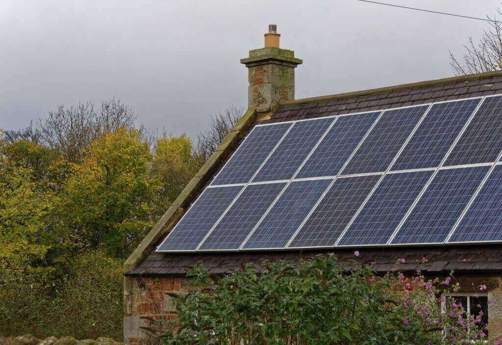 many solar panels on a rooftop in the UK